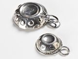 two charms that are sitting on top of each other