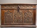 an old wooden chest with carvings and carvings on the front