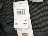 a close up of a shirt with a tag on it