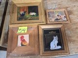 four framed pictures of cats and chickens on a table