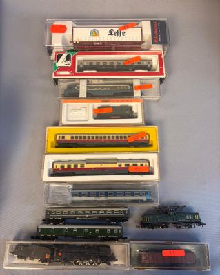 a lot of toy trains that are sitting on a table