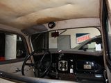 a view of the inside of a car from the driver ' s seat