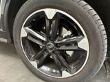 a close up of a tire on a car in a garage