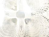 an image of a white table with a fan in the middle of it