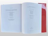 a book open to a page with a poem on it