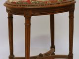a small table with a floral design on top of it