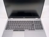 an open laptop computer sitting on top of a white table