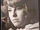 a black and white photo of a woman with long hair