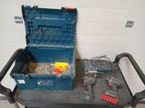 a blue tool box sitting on top of a cart