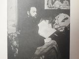 an old black and white photo of a man sitting at a desk