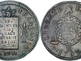 an old silver coin with a seal on the front and a seal on the back