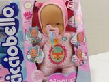 a pink teddy bear in a box next to a box of toothbrushes