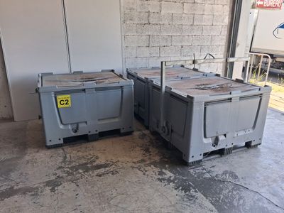 two boxes sitting next to each other in a garage