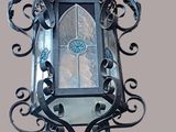 a mirror hanging on the wall with a decorative design