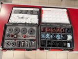 a box of tools sitting on a table with a sheet of paper