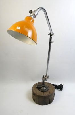 an image of a desk lamp with a wooden base and a yellow shade