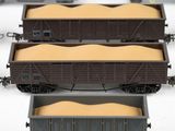 three train cars that are sitting next to each other