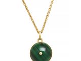 a gold plated necklace with a green stone pendant on a gold chain