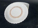 a white plate with a red and yellow design on it