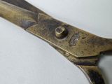 a close up of a pair of scissors on a table