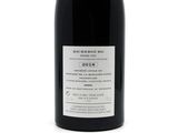 a bottle of wine that is sitting on a table