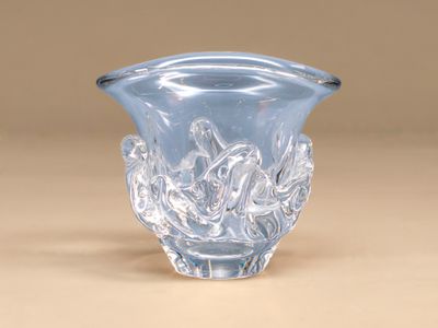a clear glass vase with a design on it