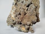 a close up of a piece of rock on a white surface