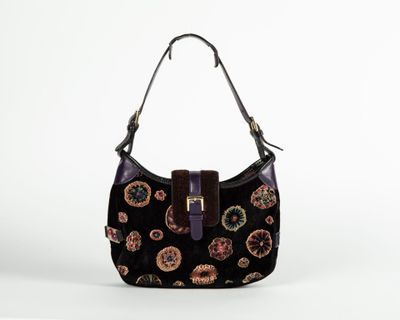a black purse with paisley print on it