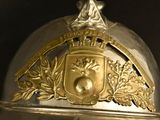 a close up of a helmet with a coat of arms on it