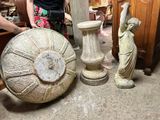 a woman that is standing next to some vases