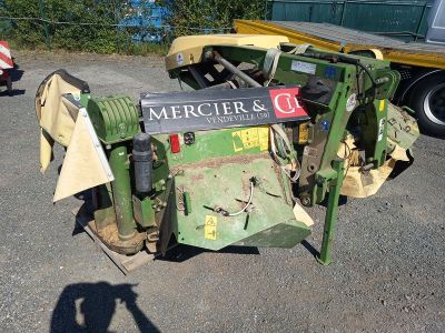 a tractor that is sitting on the ground with a sign on it