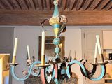 a chandelier hanging from the ceiling in a living room