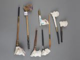 many different types of brooms and brushes on the table
