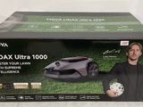 the box of a lawn mower with a man holding a soccer ball