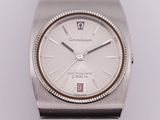 a close up of a wrist watch on a white surface