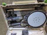 a box with tools inside of it sitting on the floor