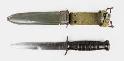 two different types of knives on a white surface