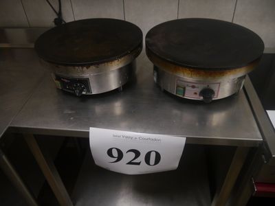 two crock pots on a table with a price tag