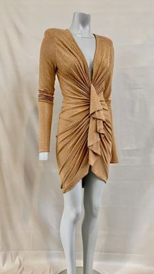an image of a mannequin dressed in a tan dress
