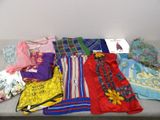 many different types of clothing laid out on a table