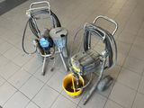 two machines that are sitting on the floor next to each other
