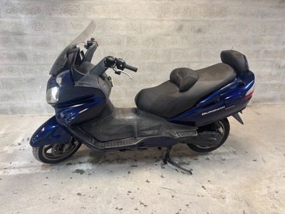 a scooter that is parked in a garage