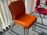 two chairs sitting next to each other in a room