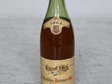 a bottle of wine that is sitting on a table