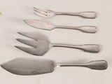 four forks and a knife on a white table