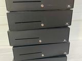 a black chest of drawers with a pair of shoes on top of it