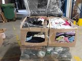 a pile of boxes of clothing in a warehouse