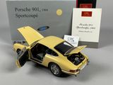 yellow model of a porsche 901 sports coupe with its open door open