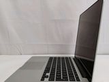 a laptop that is sitting on a white table
