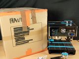 a box and a coffee machine sitting on a table